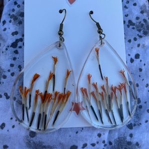 Handmade resin jewelry. Real botanical in clear ones. Marigold seeds